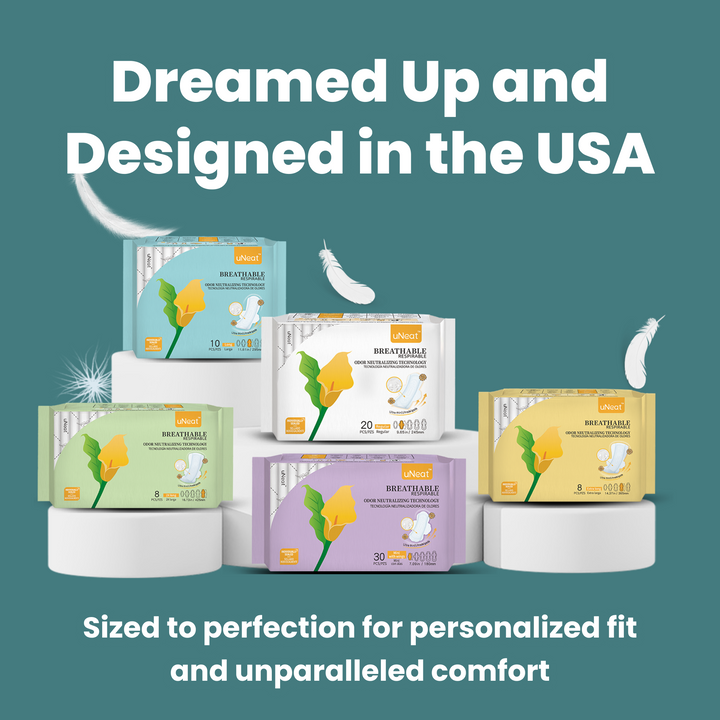 Close-up of uNeat Breathable Sanitary Pads in various sizes. Green background. Text on image: "Dreamed Up & Designed in the USA. Sized for Personalized Fit & Unparalleled Comfort.”