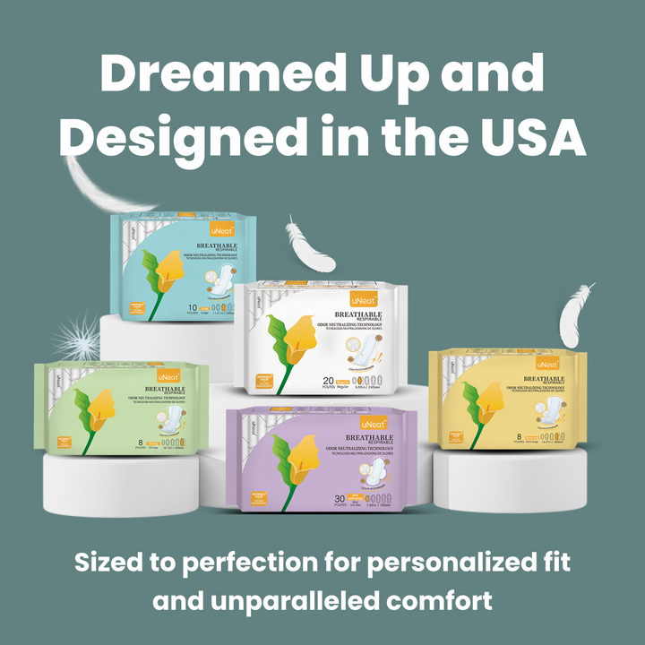 Close-up of uNeat Breathable Sanitary Pads in various sizes. blue background. Text on image: "Dreamed Up & Designed in the USA. Sized for Personalized Fit & Unparalleled Comfort.”