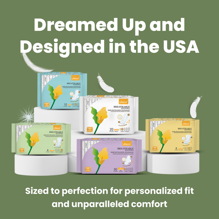 Close-up of uNeat Breathable Sanitary Pads in various sizes. gree background. Text on image: "Dreamed Up & Designed in the USA. Sized for Personalized Fit & Unparalleled Comfort.”