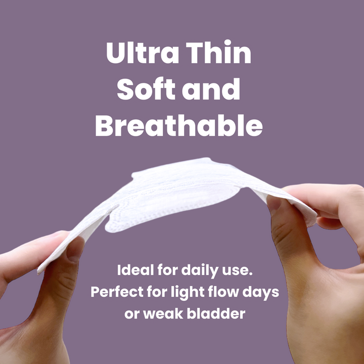 Image of a model holding a uNeat Breathable Sanitary Pads on a purple background. Text in image: Ultra Thin Soft and Breathable. Ideal for daily use. Perfect for light flow days or weak bladder.